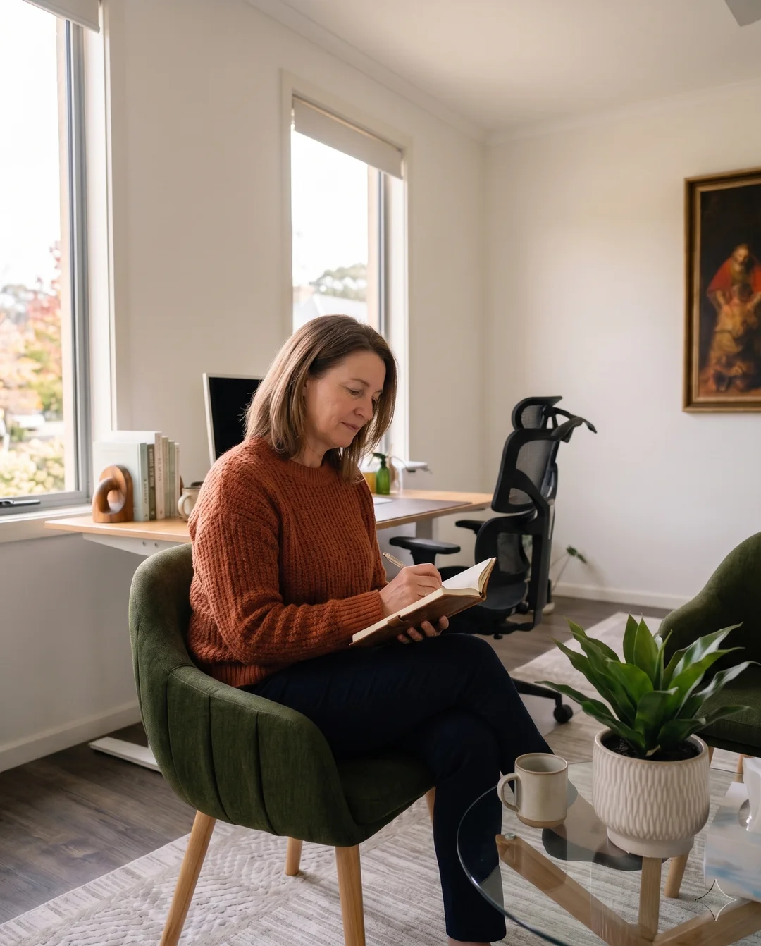 Woman journalling in a therapy-inspired setting